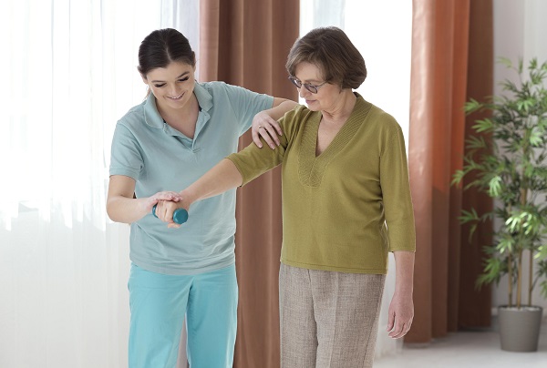 medium-shot-woman-holding-dumbbell Helping a women to recover her strength